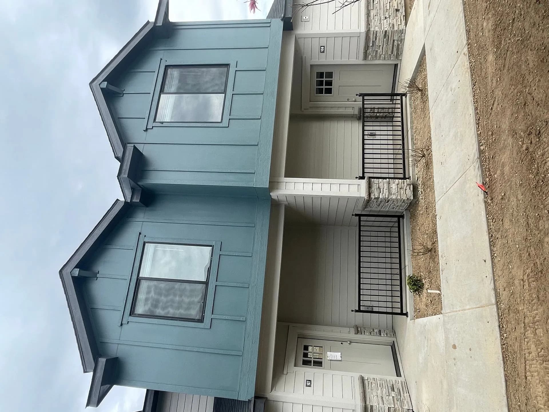 Detailed view of the modern craftsman-style entry doors and hardware