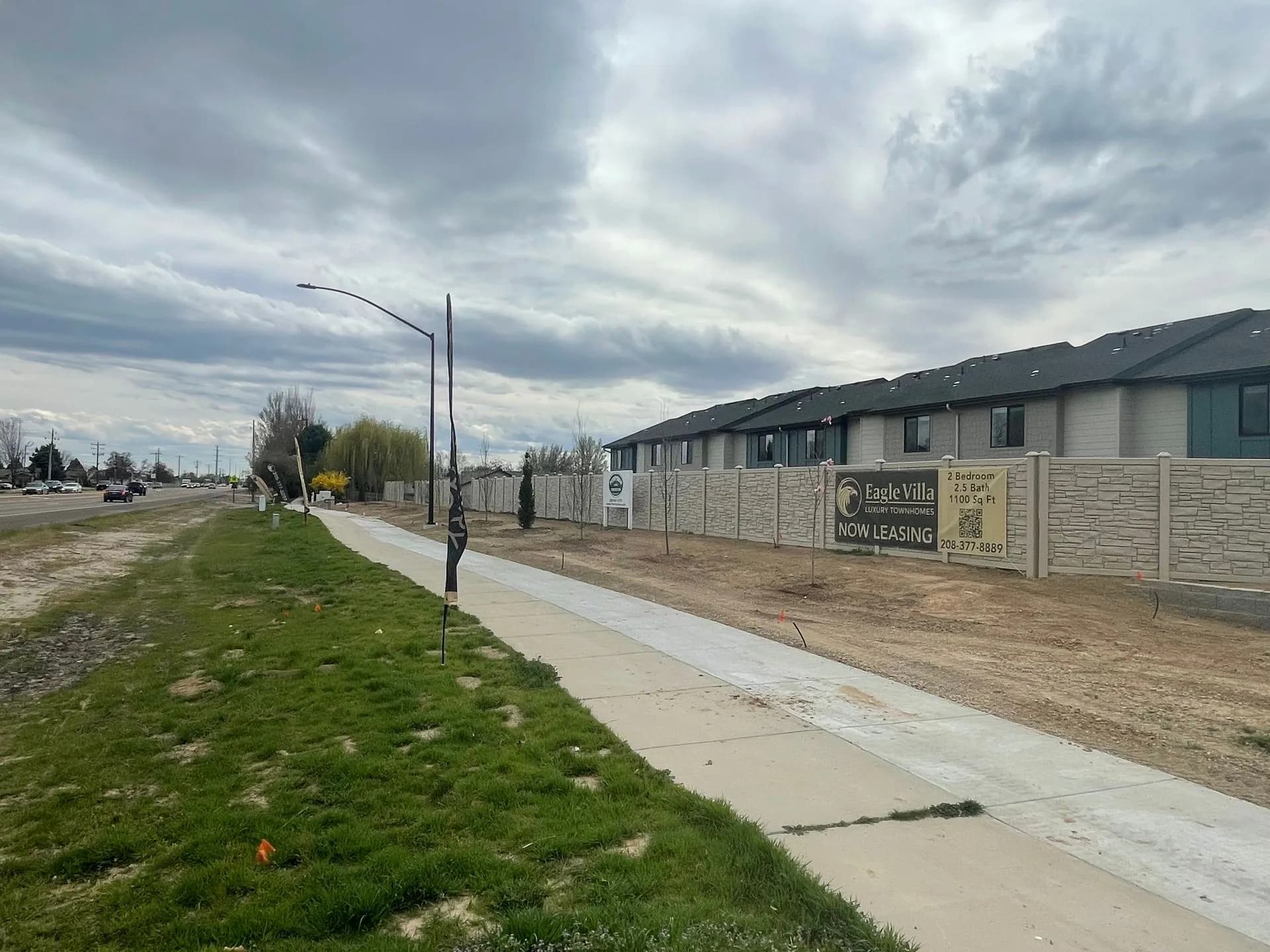 Now Leasing signage at the entrance of Eagle Villa townhomes in Boise